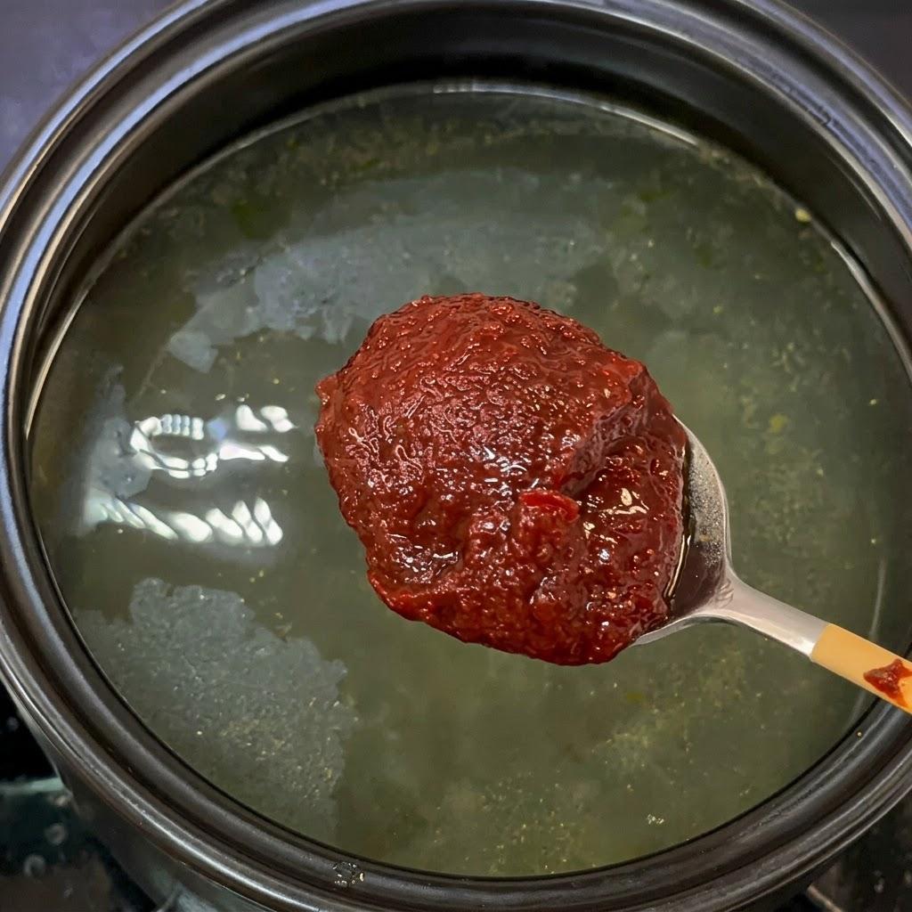 Dissolving Gochujang paste in water